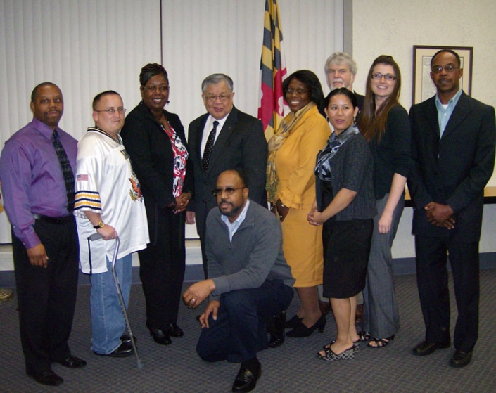 Kneeling - George King. Left to Right: Naham Perry, Robert Smith, Patricia Hawkins, Secretary Chow, Pamela Grinnell, Gail Schnell, James Mingey, Allyson Williams, & James Tingle.
