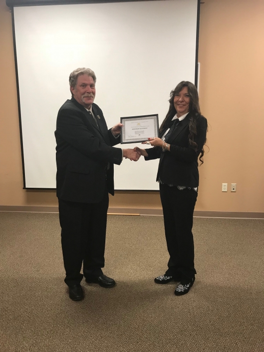 Deborah Kennedy receiving Certificate of Completion