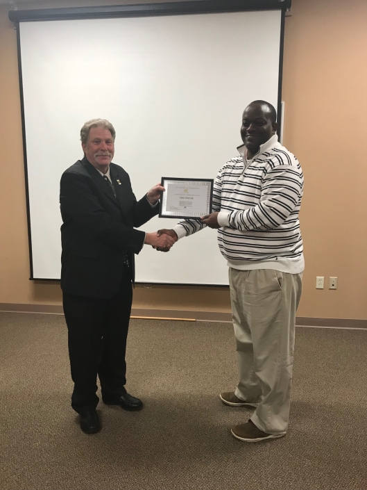 Eric Taylor receiving Certificate of Completion