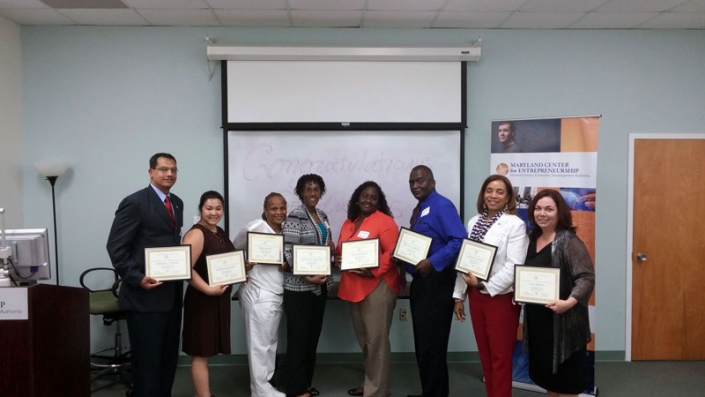 Columbia MD Spring 2014 Graduating Class. Left to Right: Engique Young, Jen Leong, Terri Coates, Cynthia Phillips, Salisha Wood, Melvin B. Johnson, Gladys Lanier, and Lynn Bryan