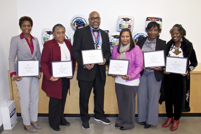 Left to Right: Lachrisha Parker, LaTonia Staten, Peter M. Modlin, Natasha Clendenin-Bey, Gail Robinson, Josephine Murdock. Not Pictured: Christopher DeRuyter, Delbert Randall