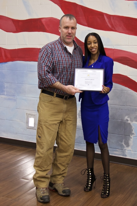 John W. Green receiving Certificate of Completion from Tiffany W. Davis, Course Facilitator