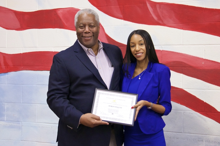 Myron Higgins receiving Certificate of Completion from Tiffany W. Davis, Course Facilitator