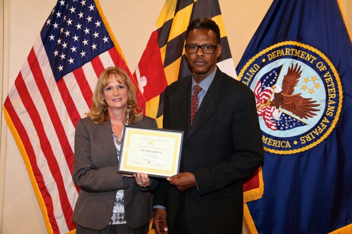 Brenda Dilts Course Facilitator presenting Certificate of Completion to Talford Greene