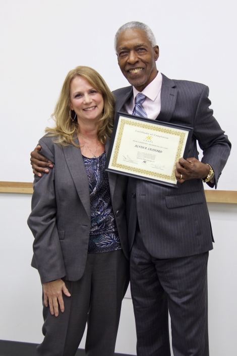 Brenda Dilts, Course Facilitator, presenting Graduation Certificate to Alvin P. Leonard