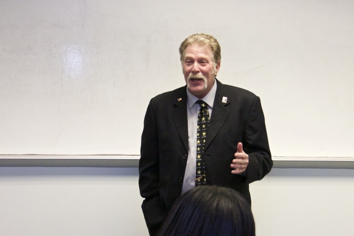 Joe Giordano addressing graduates and guests