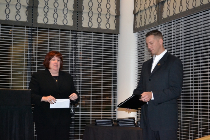 Lara Fritts, President/CEO of Annapolis Economic Development Corporation presenting Major Robert Dyer with token of appreciation.