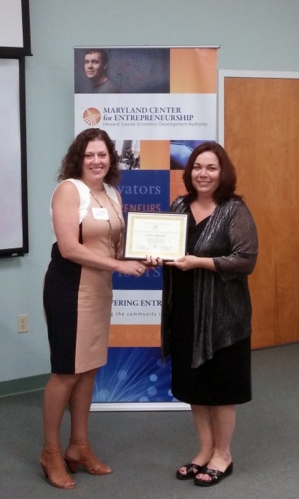 Instructor Irina Vishnevtsky presenting Lynn Bryan with Certificate of Completion