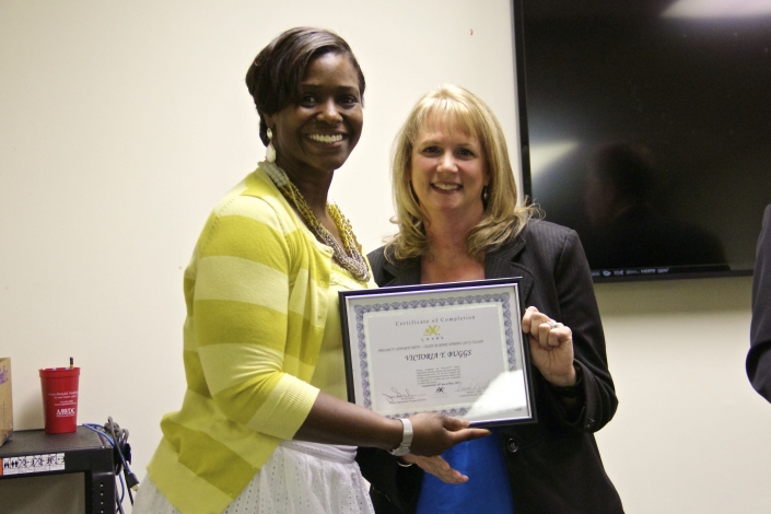 Brenda Dilts Course Facilitator presenting Graduation Certificate to Victoria Y. Buggs