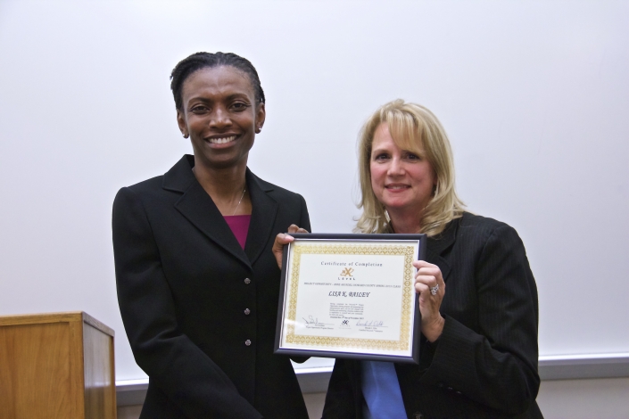 Brenda Dilts, Course Facilitator, presenting Graduation Certificate to Lisa Bailey