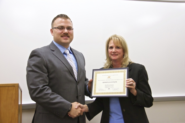 Brenda Dilts, Course Facilitator, presenting Graduation Certificate to Robert Goldinger