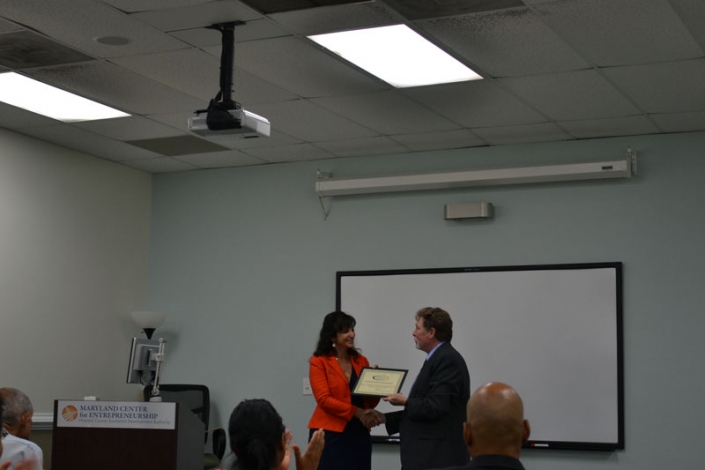 Joe presenting Julie Kirk Lenzer with a Certificate of Appreciation for her efforts in support of Project Opportunity