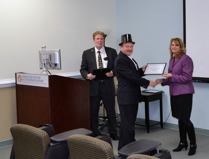 Sonny Merryman receiving his Certificate of Completion from Brenda Dilts, course instructor