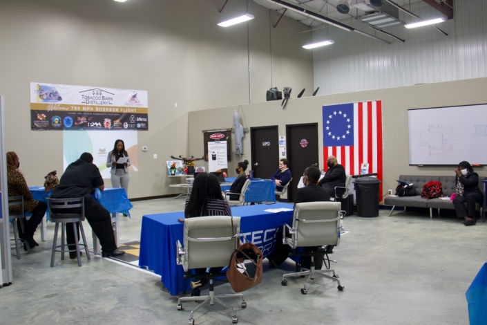 Guest Speaker Adrienne Somerville, CEO Somerville Consulting Group and Graduate of Project Opportunity<sup>SM</sup> Southern Maryland Fall 2019 Class addressing the Graduating Class