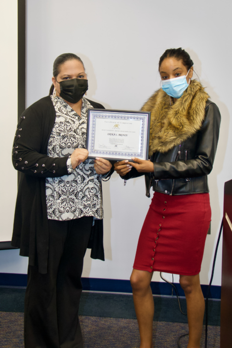 Tiffany Davis Course Facilitator presenting Graduation Certificate to Brooke Pierson Mabry