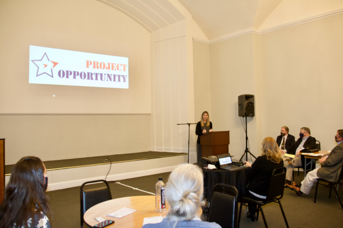 Guest Speaker Kristen Earp, Founder Kristen Earp LLC and Military Spouse Fall 2020 Class Graduate, addressing graduates and guests