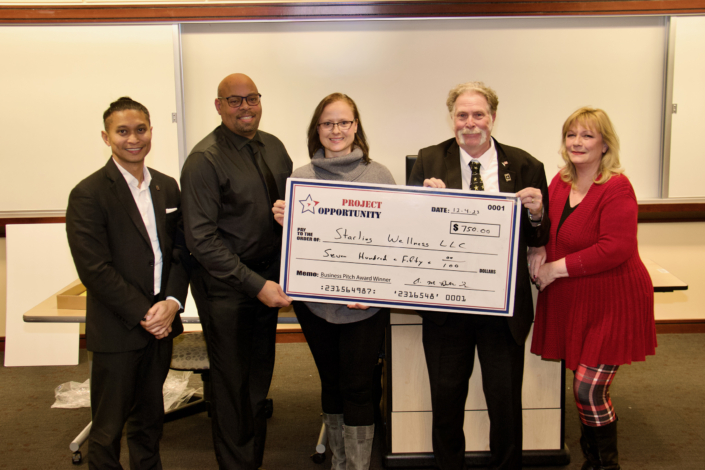 Check Presentation to Joanna Starling 1st Place Business Pitch Left to Right: Emmyrich Vicente (PNC Bank and Business Pitch Judge); Anthony Butler Sr. Course Facilitator; Joanna Starling; Joe Giordano Project Opportunity Founder, and Kim McGettigan (Montgomery College and Business Pitch Judge)