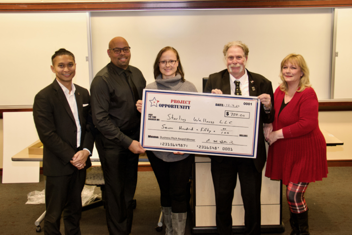 Check Presentation to Joanna Starling 1st Place Business Pitch Left to Right: Emmyrich Vicente (PNC Bank and Business Pitch Judge); Anthony Butler Sr. Course Facilitator; Joanna Starling; Joe Giordano Project Opportunity<sup>SM</sup> Founder, and Kim McGettigan (Montgomery College and Business Pitch Judge)