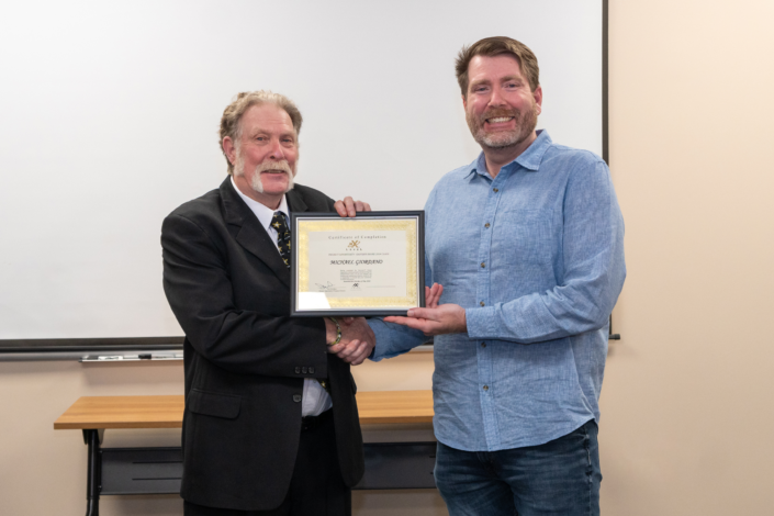 Michael Giordano - Receives Graduation Certificate