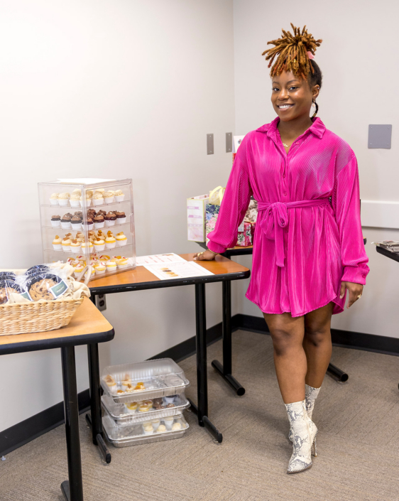 Erika Eppers with Sweet L's Cakery display