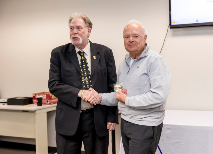 Presenting Project Opportunity Coin to Phil Loga, Business Pitch Judge